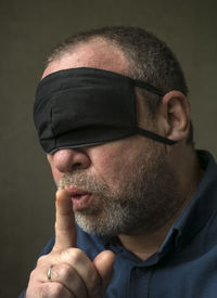 Close-up portrait of man wearing mask