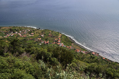 High angle view of townscape by sea