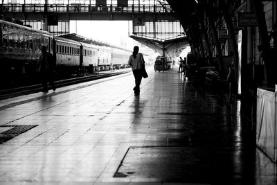 Man walking on railroad station platform