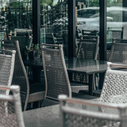 Empty chairs and tables in cafe