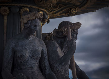 Low angle view of statue against sky