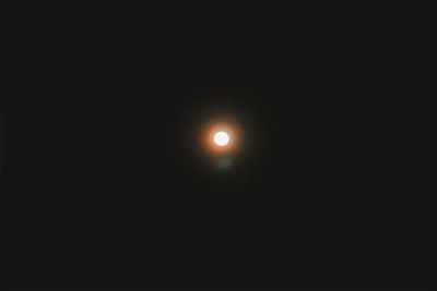 Low angle view of moon against sky at night