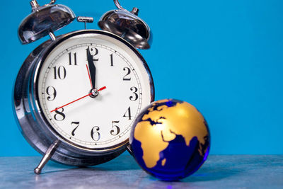 Close-up of clock on table