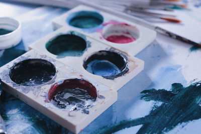 Close-up of messy palette on table