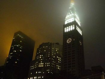 Low angle view of modern skyscraper at night