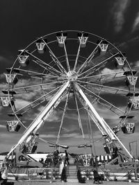 Low angle view of ferris wheel against sky