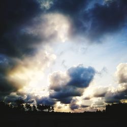 Low angle view of silhouette field against sky