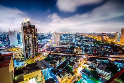 Cityscape against cloudy sky