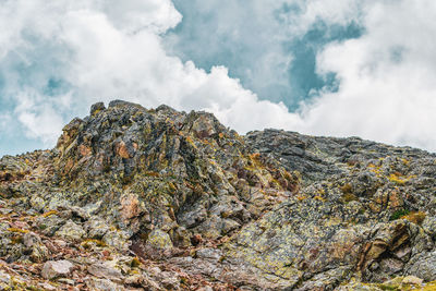 Low angle view of rock formation against sky