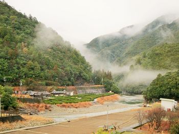 Scenic view of mountains during foggy weather