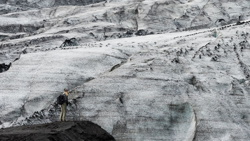 High angle view of man climbing on mountain