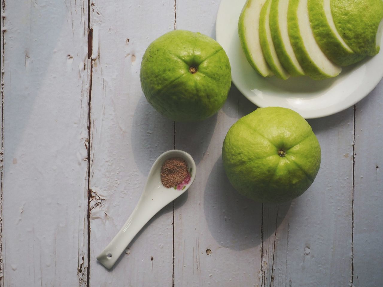 food and drink, healthy eating, food, wellbeing, fruit, freshness, green, wood, plant, produce, apple, studio shot, indoors, no people, apple - fruit, still life, high angle view, slice, tableware, granny smith, cross section, group of objects, table, granny smith apple, vegetable