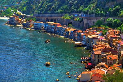 High angle view of townscape by sea