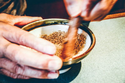 Close-up of woman hand holding bowl