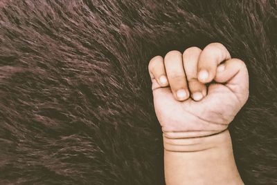 Close-up of person hand over water