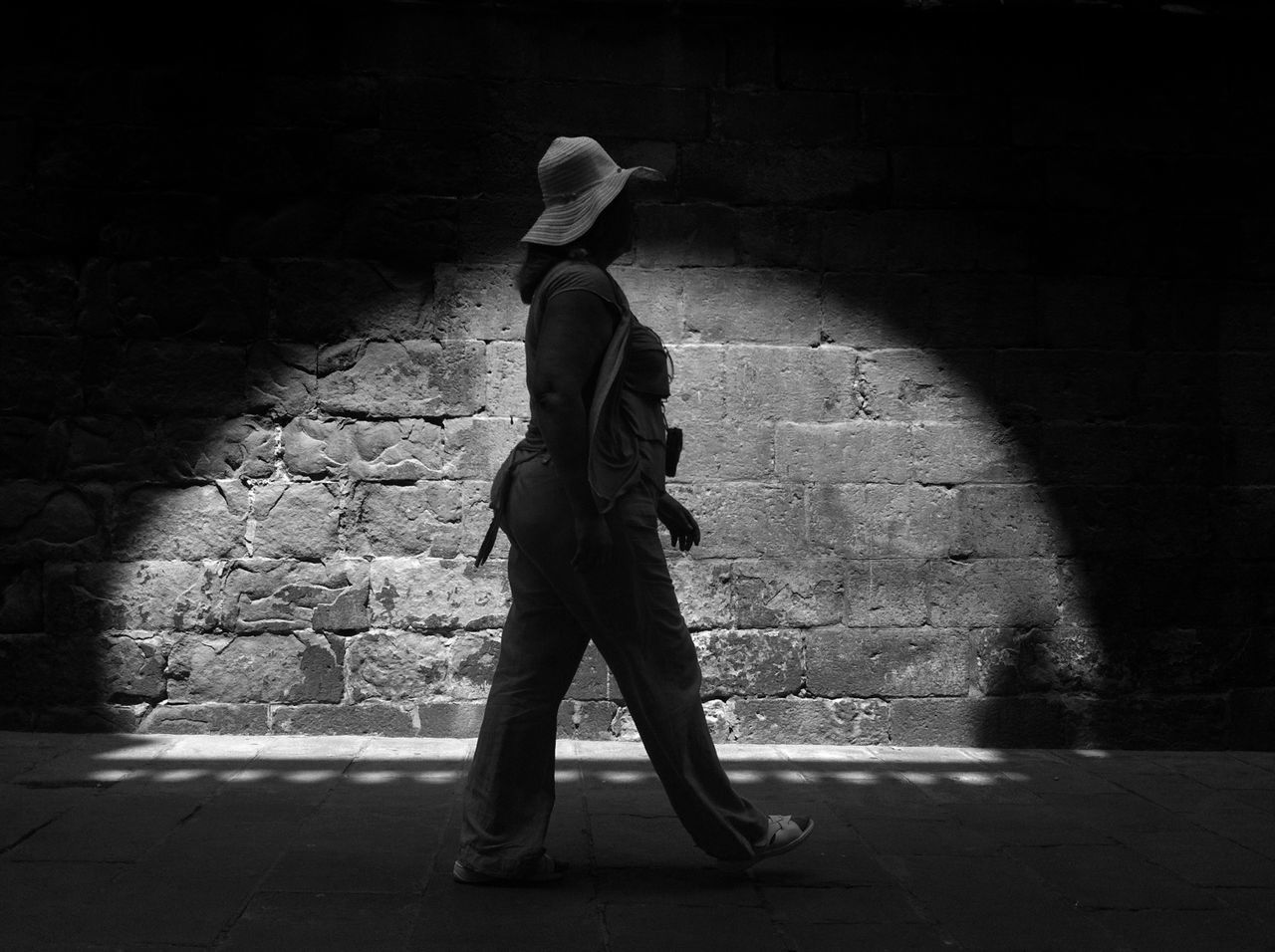 full length, street, lifestyles, shadow, casual clothing, road, night, leisure activity, standing, men, childhood, sunlight, walking, sidewalk, side view, rear view, skateboard, outdoors