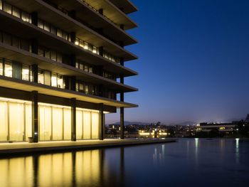 Reflection of buildings in calm water