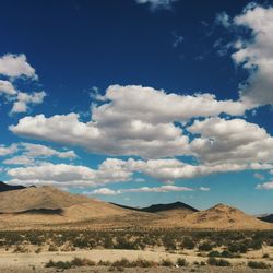 Scenic view of landscape against cloudy sky