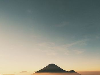 Scenic view of silhouette mountain against sky during sunset