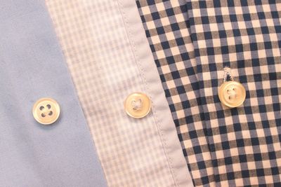 Cropped image of fabric with buttons