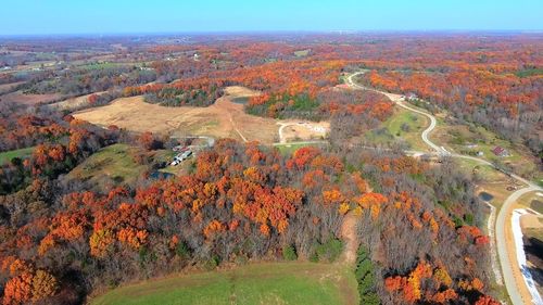 High angle view of trees on landscape against sky