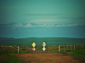 Scenic view of mountains against cloudy sky