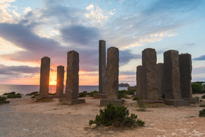 Ibiza, spain, october 23 2021, beautiful sunset near the stonege monument of ibiza at cala llentia