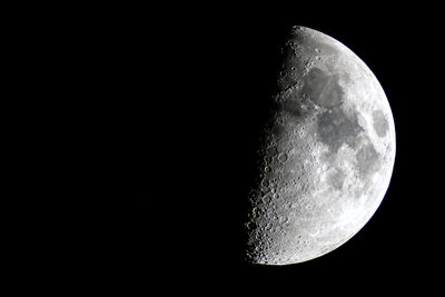 Low angle view of moon against sky at night