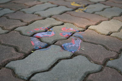 High angle view of stones on wet street