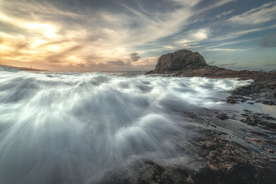 Scenic view of sea against sky during sunset