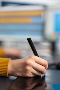 Close-up of man using mobile phone