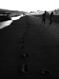 View of woman standing on beach