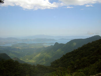 Scenic view of mountains against cloudy sky