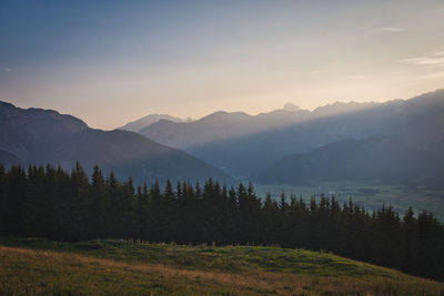 Scenic view of mountains against sky during sunset