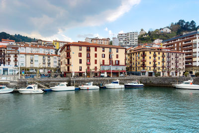 Boats moored at harbor