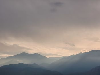 Scenic view of mountains against sky during sunset