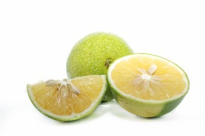 Close-up of lemon slice against white background