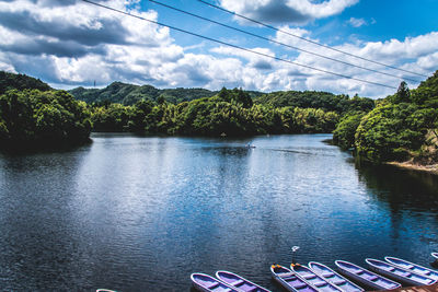 Scenic view of lake against cloudy sky