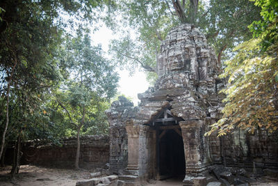 Old temple amidst trees and building