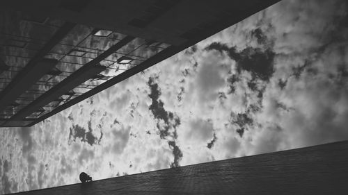 Low angle view of built structure against cloudy sky