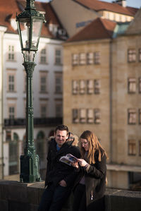 Young couple in front of building