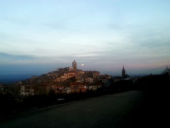 View of city against cloudy sky