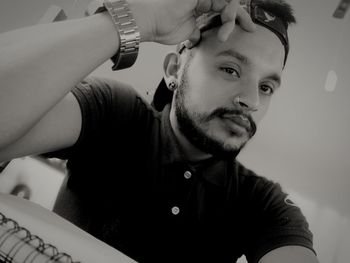 Portrait of young man with camera