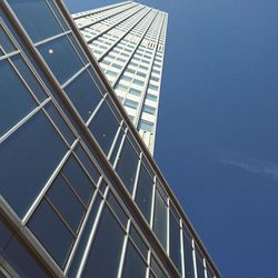 Low angle view of skyscraper against clear sky