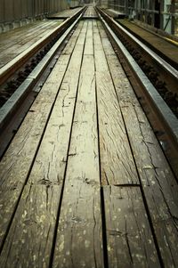 Railroad tracks on wooden floor