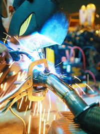 Close-up of worker welding equipment