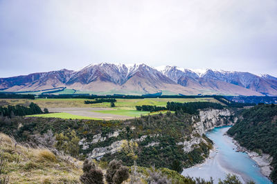 Scenic view of snowcapped mountains against sky