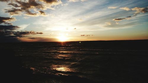 Scenic view of calm sea at sunset