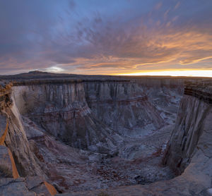 Epic sunrise aerial panorama above massive coal mine canyon on n