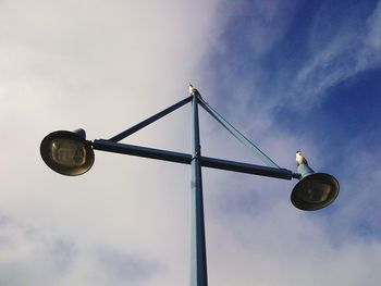 Low angle view of street light against sky